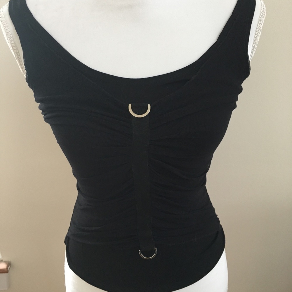 Sleeveless tank with ruching/netting in front.